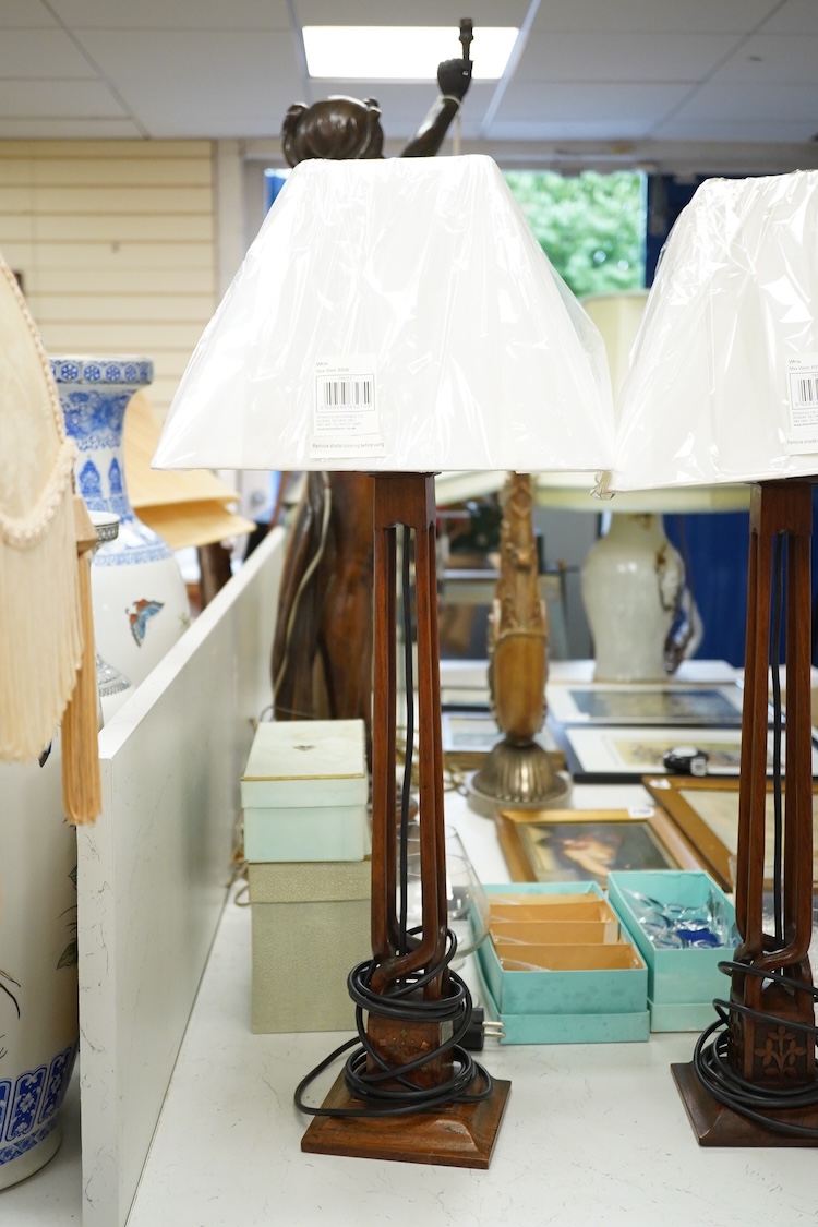 Three Indian hardwood table lamps with shades, 52cm high